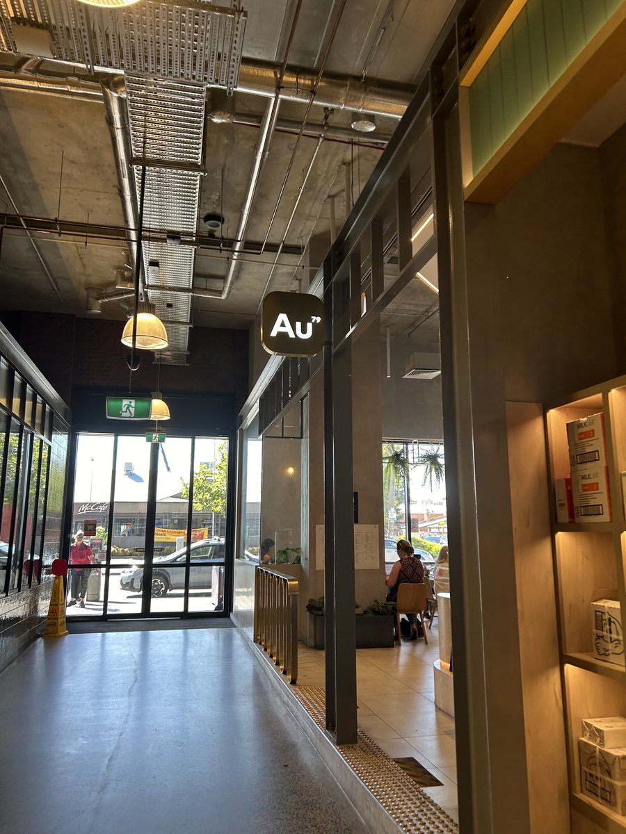 Au79 illuminated sign at the entrance corridor of Richmond Trader