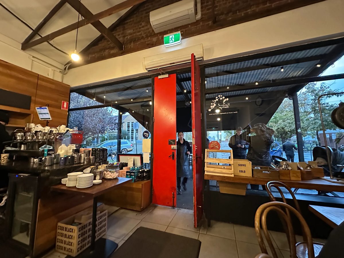 A Thousand Blessing interior with red door and coffee counter