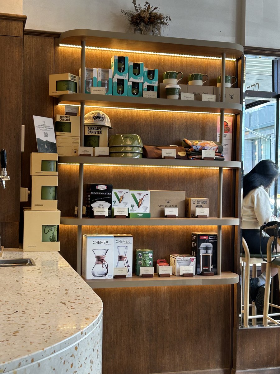Campos branded merchandise display including Chemex and Keep Cups