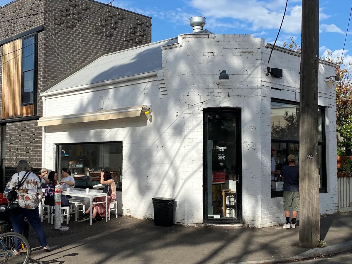 Hector's Deli corner storefront on Buckingham Street with outdoor seating