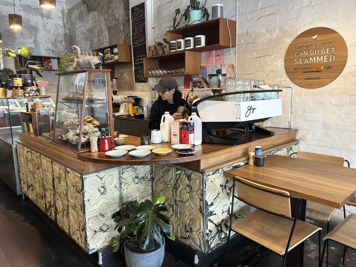 Barista working at the vintage tiled counter at LumberJack