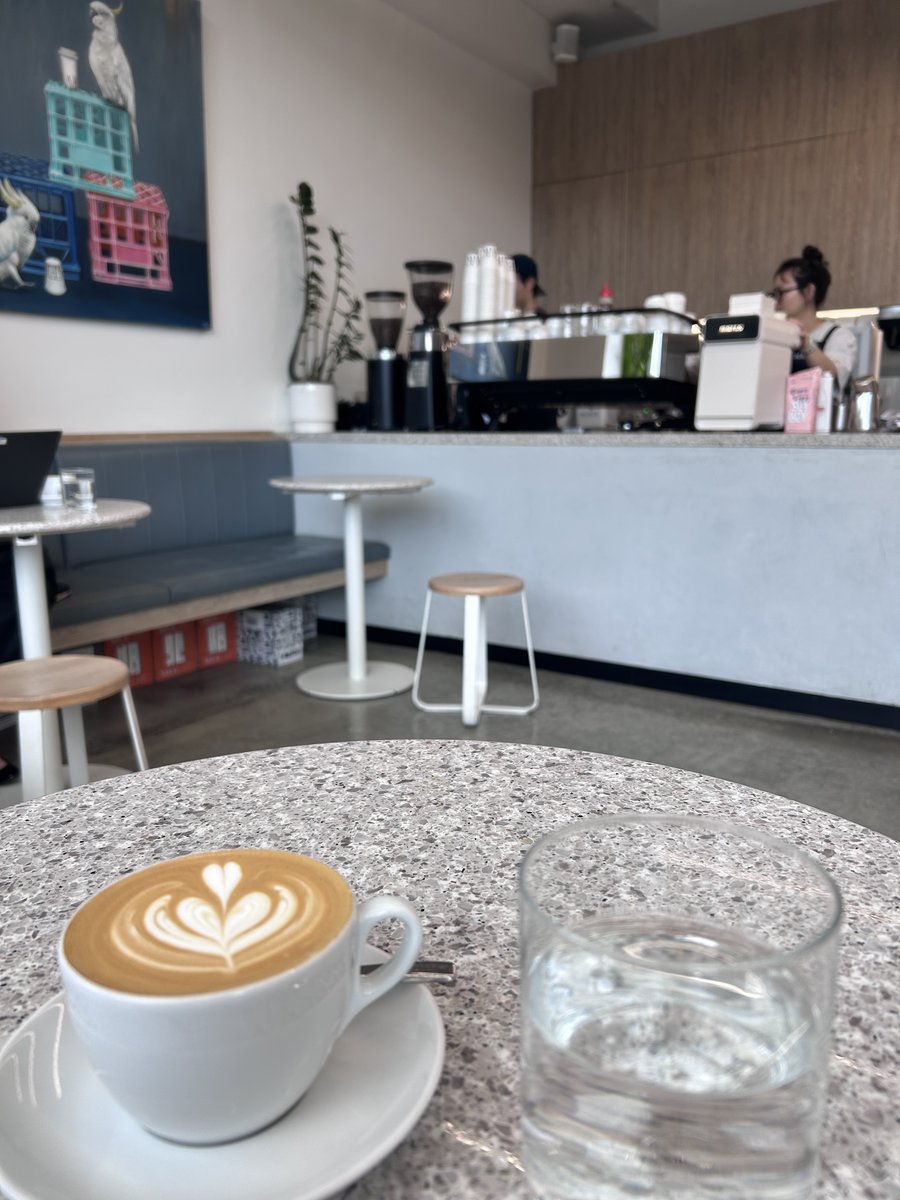 Latte with heart-shaped latte art at Maker