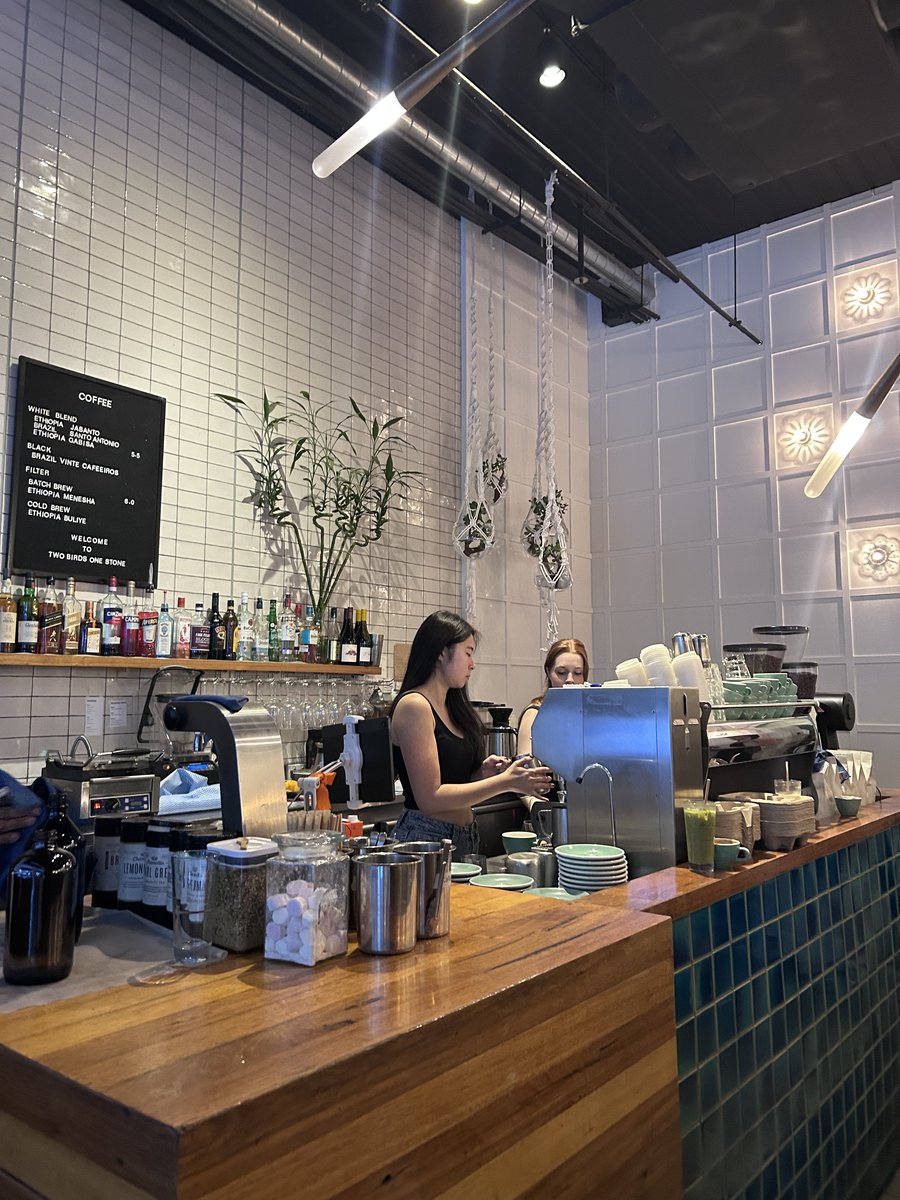 Baristas at the counter inside Two Birds One Stone