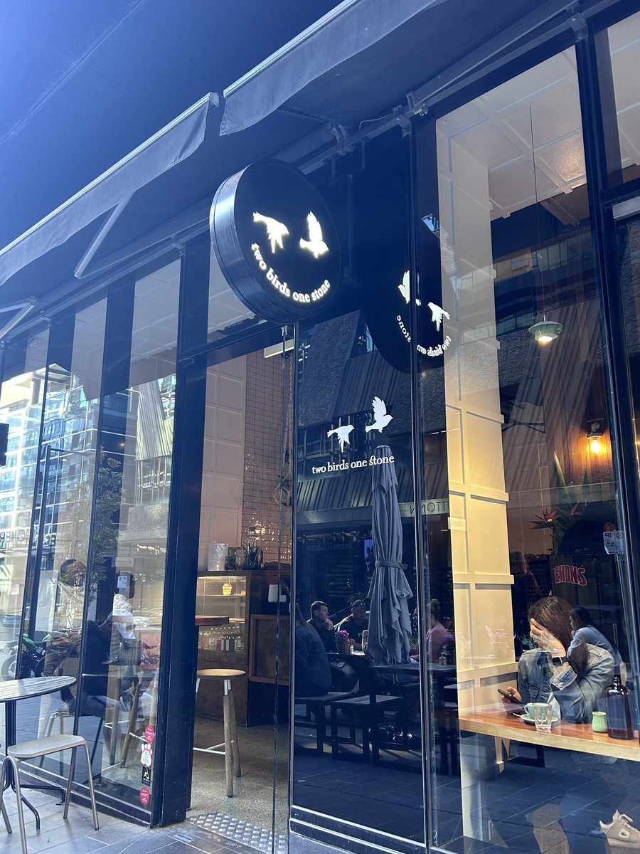 Two Birds One Stone storefront with bird logo signage
